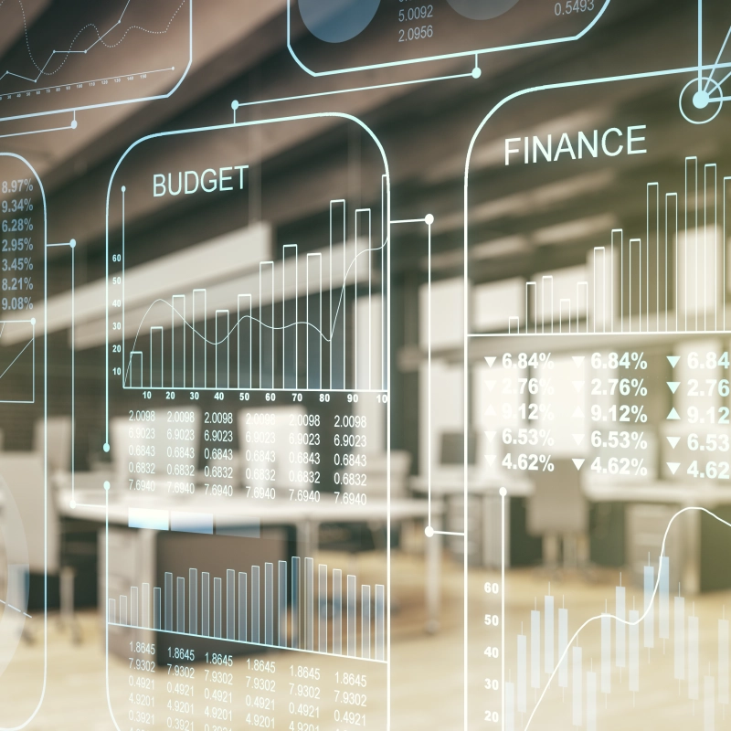 Transparente Finanzgrafiken vor moderner Büroumgebung.